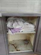 Gray composite storage cabinet measures 26 in WX 18 in DX 36 in H. Contents includes shop towels. Basement