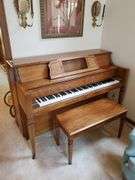 Vintage Everett piano with wood case designed by William g Faber. Measures 60 in wx 25 in DX 41 in H and includes lift top. living room