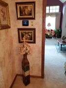 Decorative French print artwork measure 12 in by 16 in, toe metallic vase planter. Dining room.