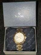 Bulova Millennia White/Yellow gold toned watch with original box. Inspect at preview.