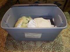 Large tote with lid marked dresses for herb guild. Basement