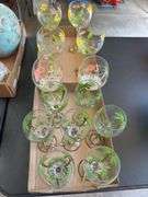 12 wine glasses, including four with dragonfly theme, two flamingo and six palm tree