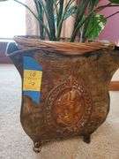 2 artificial plants in ornate planters, one with wood stand. Living room