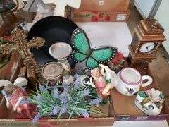 (2) box lot including (2) ceramic angel figurines, pillar candle holders, decorative crucifix, butterfly love stone, quartz mantle clock, ceramic teapot and heart-shaped trinket box. Garage