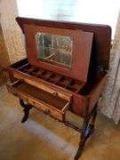 Victorian style vanity stand with lift top and storage drawer measures 32 in W 16 in D X 32 in H and features painted floral design.