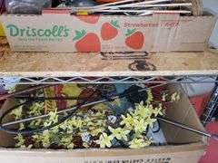 (2) shelf lot of gardening items including Miracle-Gro fertilizers, size 9 Garden Crocs, work gloves, planting pots, spring wreath, outdoor welcome flag. Garage