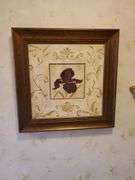 (2) mirrored brass candle sconces, 1 minerature wall shelf with figurine, and framed and matted floral art works by Laurel Lehman 20 in square. All for your bid! Master bathroom