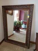 Ornate, bevel edged, wall mirror measures 33 in WX 45 in H.. Living room