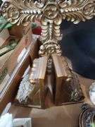 (2) box lot including (2) ceramic angel figurines, pillar candle holders, decorative crucifix, butterfly love stone, quartz mantle clock, ceramic teapot and heart-shaped trinket box. Garage