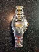 Bulova Millennia White/Yellow gold toned watch with original box. Inspect at preview.