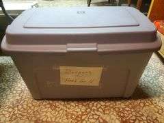 Large tote with lid marked dresses for herb guild. Basement