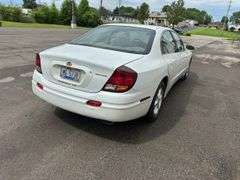 2001 Oldsmobile Aurora 4 dr. sedan, 3.5 L V6 engine, auto trans, full power including power windows, driver side power adjustable seat, beige leather seats, luster white exterior, only 27,572 miles!  See photos!   Runs and drives like new!  Payment in full by cash, certified check, or wire transfer payable to Basinger Auction Service at time of pickup on days noted.