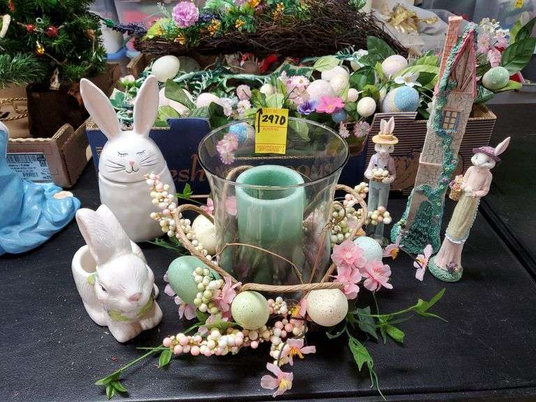 Easter items including ceramic bunny figurines, composite bunny figurines, glass candle centerpiece, Easter candle holders, Easter lights. Basement.