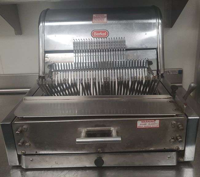 Berkel Model 7/16" stainless commercieal bread slicer working in service.