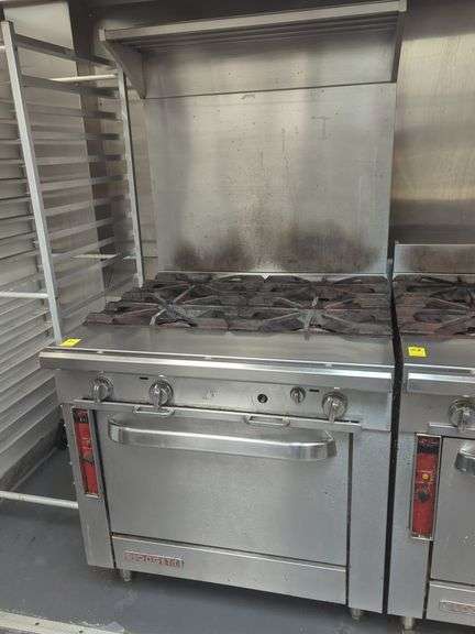Blodgett 4 burner 36-In stainless steel commercial gas range with backsplash and shelf.
