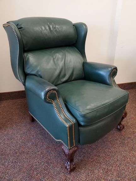 Robb & Sticky Collection green vinyl wingback recliner with brass button accent and ball and claw feet. Inspect at preview.