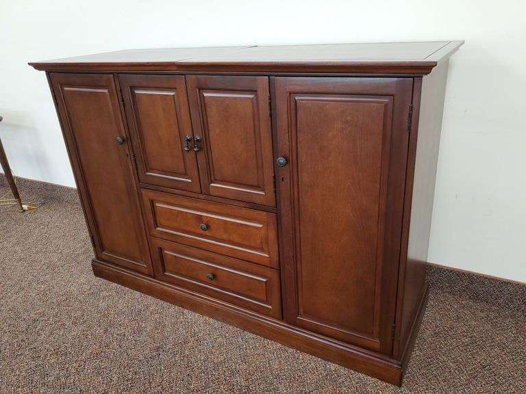 Howard Miller Devino II Wine & Bar Cabinet measures 60 in w x 20 in D X 40 in H.