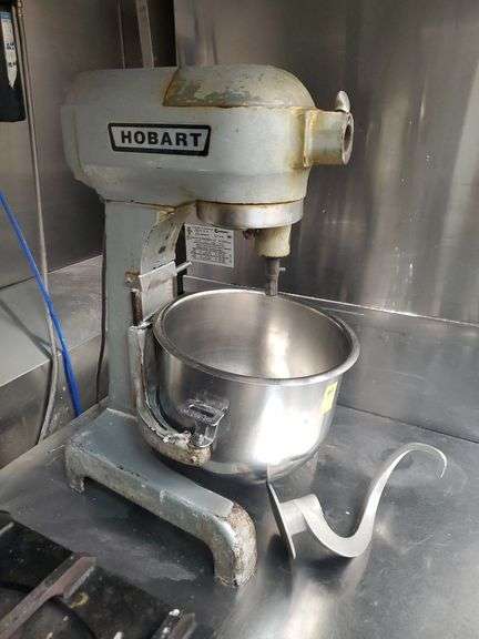 Hobart model A200T mixer with dough hook , whisk  and stainless steel table 36x30x25... No other contents