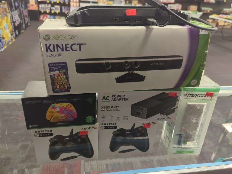 Group of Xbox related items including controllers, AC, power adapter, charging stand, intercooler, kinect sensor without game, all for your bid