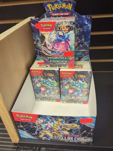 Three unopened packs of pokémon temporal forces, stellar crown build battle cards. Includes retail display