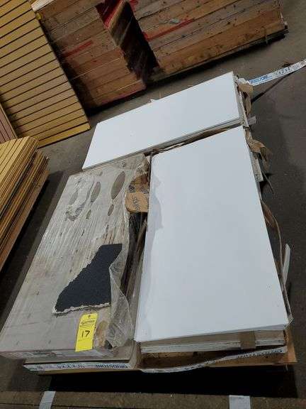 (7) boxes new Gridstone brand, fire shield gypsum ceiling panels measure 1/2-in thick X 24-in W X 48-in L. Approximately 32-in white panels.  (1) box, USG ceiling panels, 1/2 in thick X 24 in wx 48 in L in black finish, some panels are damaged. Tow motor available to load onto trailer.