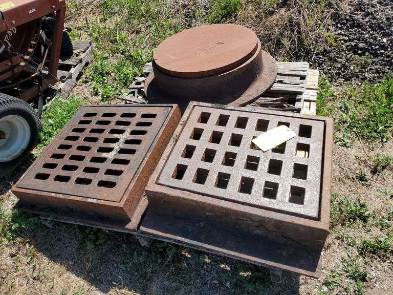 Heavy duty cast iron drain covers with two square and one round. (1) Flange measures 26 in square and the grate measures 2 0 -1/2 in square and one and a half inch thick, (1) flange measures 25 inch by 28 in with grate measuring 22-in x 18 in X 1 and 1/2-in D, round flange measures approximately 33 in round with 22 - 1/2 in cover. Tow motor available to load onto your trailer.