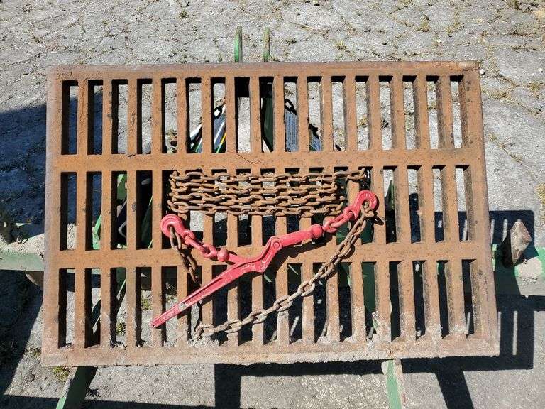 Cast iron drain cover with flange. Flange measures 32 in W X 44 in L X 9 in H. Grate measures 24 in w x 36 in L X 1 and 1/4-in H. Does not include any chains or tools. Just the grate and flange. See photos. Tow motor available to load onto trailer.