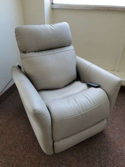 Flexsteel Industries Inc., rocking power recliner with heat and massage. Headrest and lumbar adjustments along with normal reclining functions. Light grey material. Looks brand new. Works as it should.