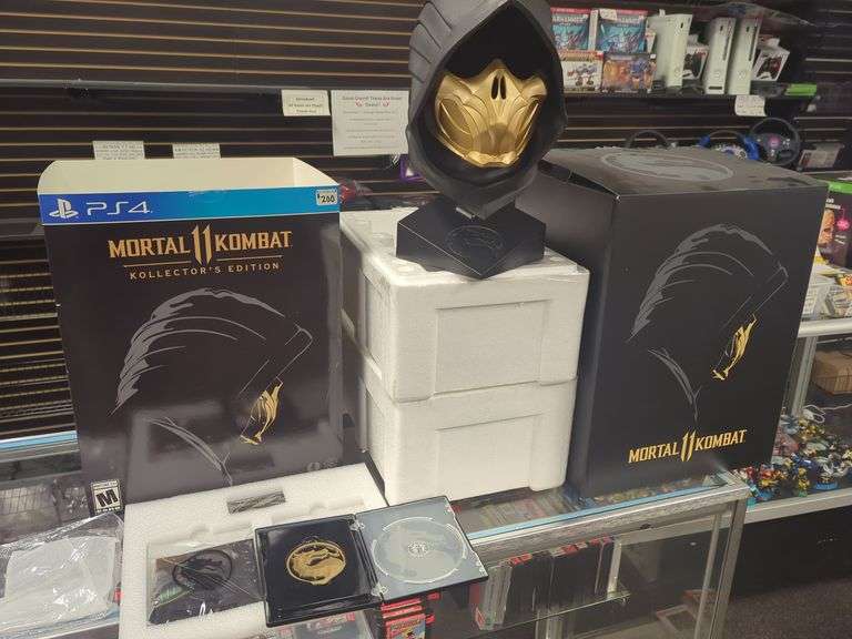 Incomplete! Missing a game! Mortal Kombat Kollector's edition includes original boxes and packaging. Includes magnetic case, display head, banner, and certificate of authenticity. Missing game!