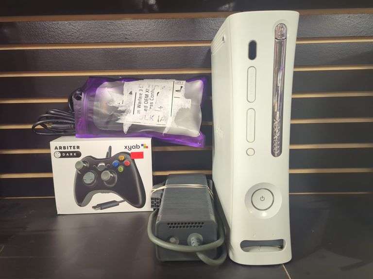 Xbox 360 with controller, power supply, AV cables. Untested
