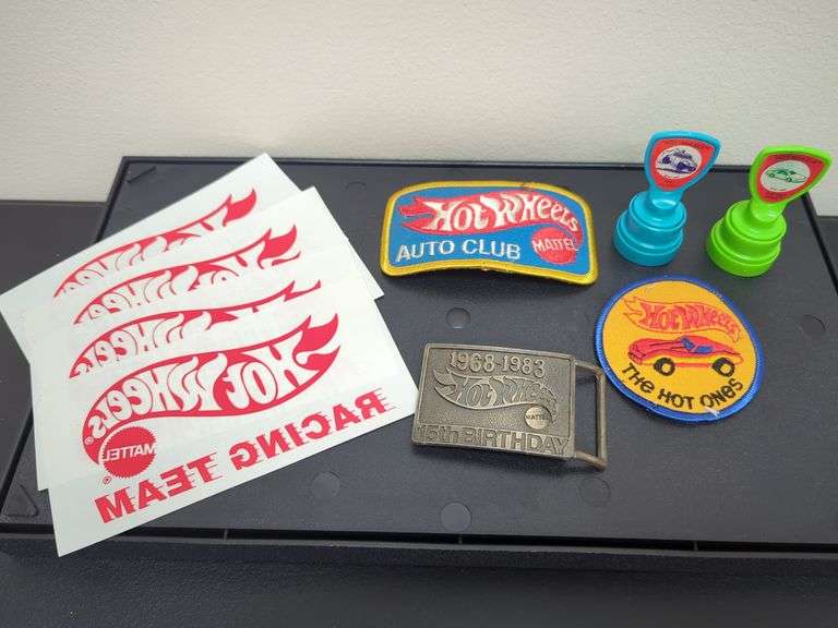 Hot Wheels vintage memorabilia including patches, iron-ons, 15th birthday belt buckle, two stamp daubers. All for your bid