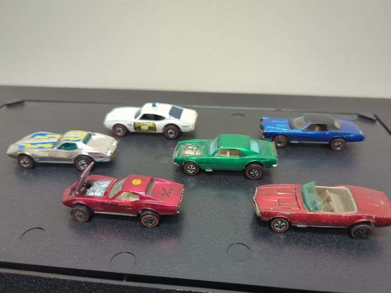 Hot Wheels. Red lines including Corvette stingray, State Police car, custom Corvette, heavy Chevy, custom El Dorado, custom firebird all for your bid as shown