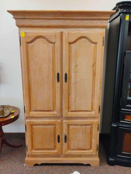 Solid white washed oak bar / entertainment center. Features locking doors with keys, roll out lower shelf and removable top shelf for moving. Measures 46 in W x  28 inches D x 78 and 1/2 in H. Can easily be repurposed even for a closet.