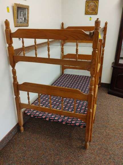 Children's mid-century twin size stacking bunk beds with ladder and safety rail for top.