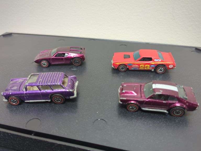 Hot Wheels. Red lines including mighty Maverick, custom nomad, AMX/2, and other. All four for your bid as shown