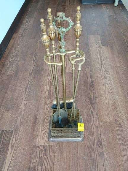 Solid brass fireplace tool set includes brush, scoop, poker, tongs.