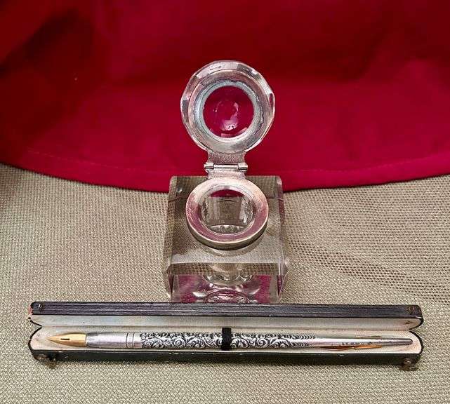 Old ink well and silver pen