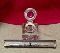 Old ink well and silver pen