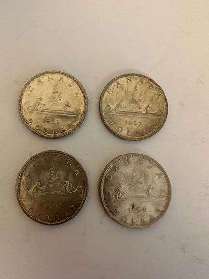Four Canadian silver dollars two 1963 and two 1966
