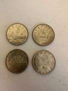 Four Canadian silver dollars two 1963 and two 1966