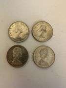 Four Canadian silver dollars two 1963 and two 1966