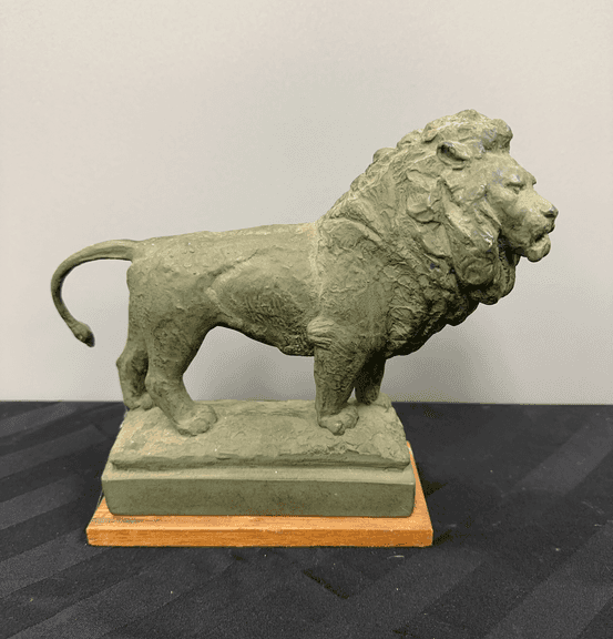 Lion Figurine on Wooden Base