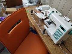 Janome DC2010 Sewing Machine Fiskars Clear Table + Orange Chair