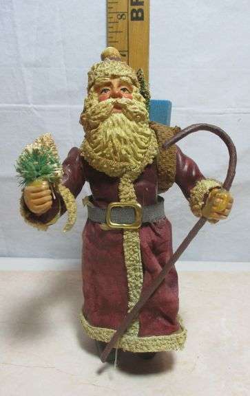 Vintage Santa Claus figurine, likely made from a fabric or paper mache material.