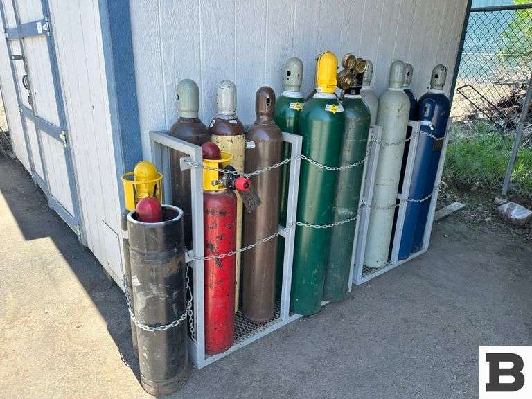 (15) Gas Bottles & Storage Rack - Booker Auction Company