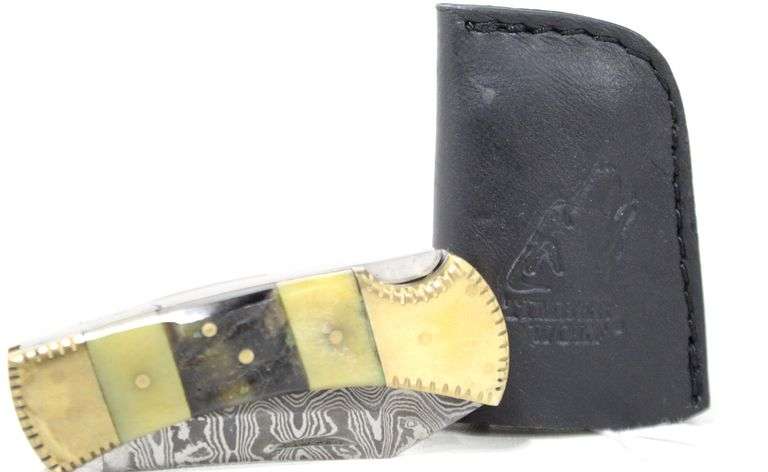 Damascus Steel folding knife with leather sheath , Has brass bound composite handle , Appears to have been handcrafted