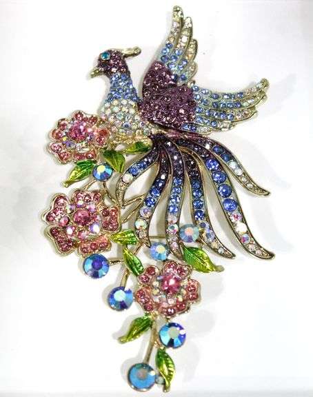 Fabulous Brooch fashioned as a peacock on flowers with SO many colorful stones.