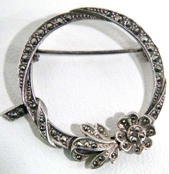 Gorgeous Sterling Silver and Marcasite circle pin with a flower embellishment