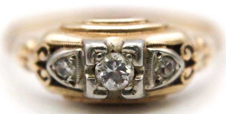 Vintage 14 KT Gold Diamond Ring, in original gift box.  Vintage setting has 3 Diamonds (tested) in carved gold.  Consignor contributes ring was purchased at S.T. Little's in Cumberland, MD