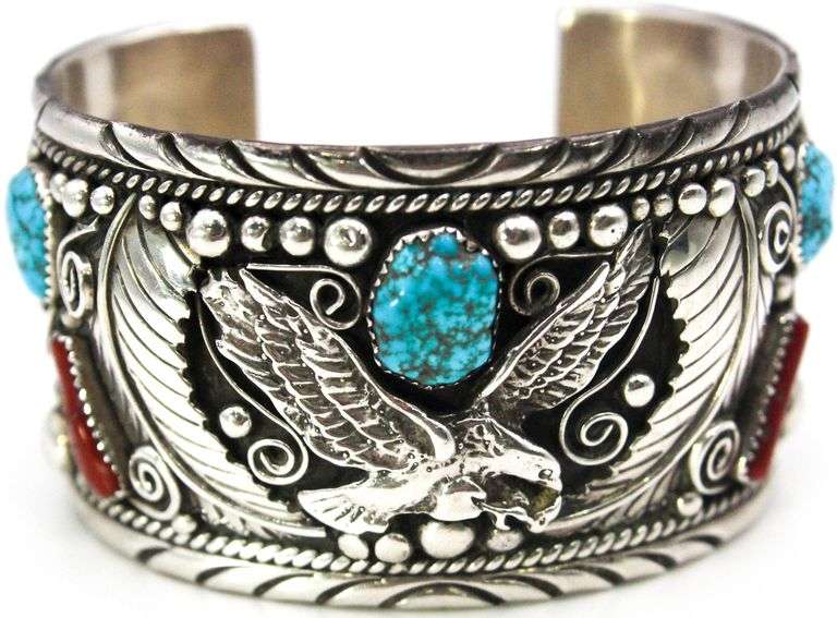 Navajo, Sterling Silver, signed, wide cuff, Bracelet with an eagle, turquoise and coral.     (124.6 gm t.wt)